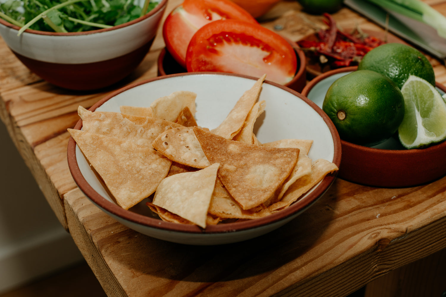 Chips and fresh produce to make handcrafted salsa